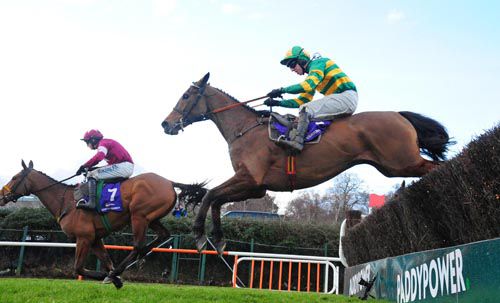 Carlingford Lough jumps the last under Mark Walsh with Road To Riches leading