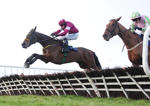 A Genie In Abottle (Bryan Cooper) jumps ahead of Call It Magic (Ruby Walsh)