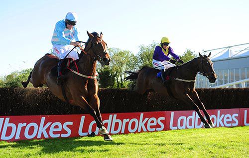 Barry Geraghty (purple and yellow, right) on Alelchi Inois, chases down Davy Russell and Sadler's Risk