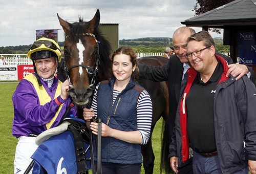 Winning connections pictured after Whiskey Sour completed a treble for Eddie Lynam (second from right)