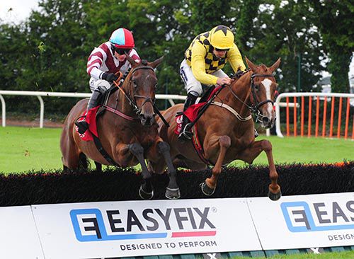Muthaza (right) leads at the last