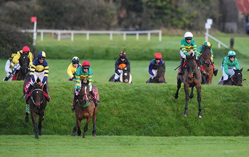 Cantlow (right) jumping a bank at Punchestown