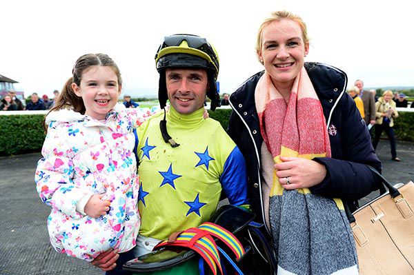 Rory Cleary pictured with his wife Sarah and daughter Orla after the victory of Landline 