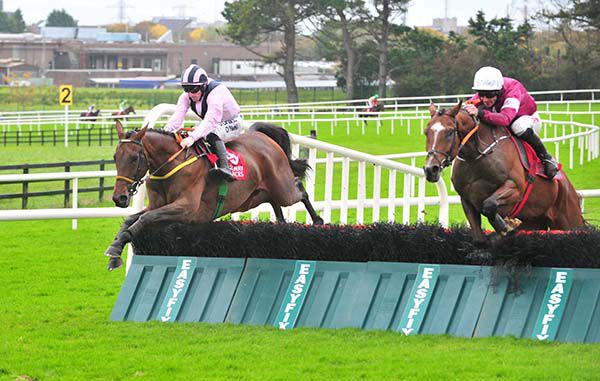 The Rory Story (pink and black) just leads Poli Roi over the last