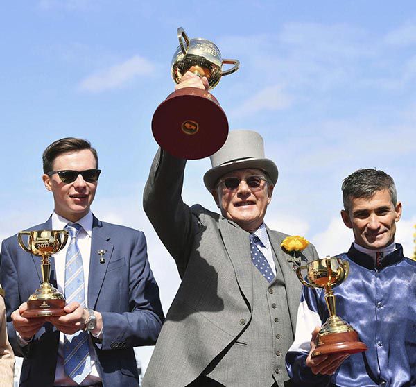 Joseph O Brien with owner Lloyd Williams and jockey Corey Brown after they won the 2017 Melbourne Cup with Rekindling 