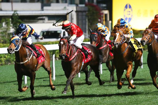 Super Fluke (red silks) lands his fourth win of the season at Happy Valley last start.