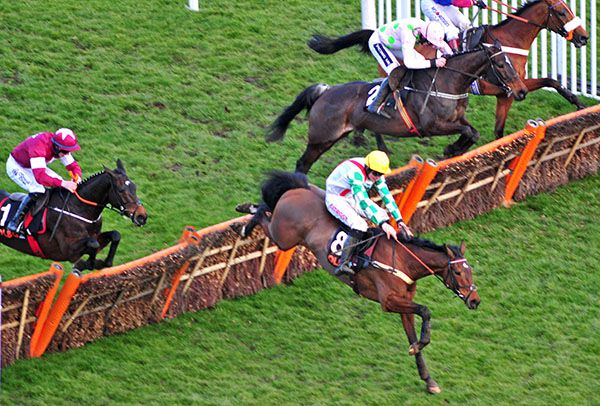Pink and green spots Ruby Walsh chases down Midnight Tour aboard winner, Benie Des Dieux