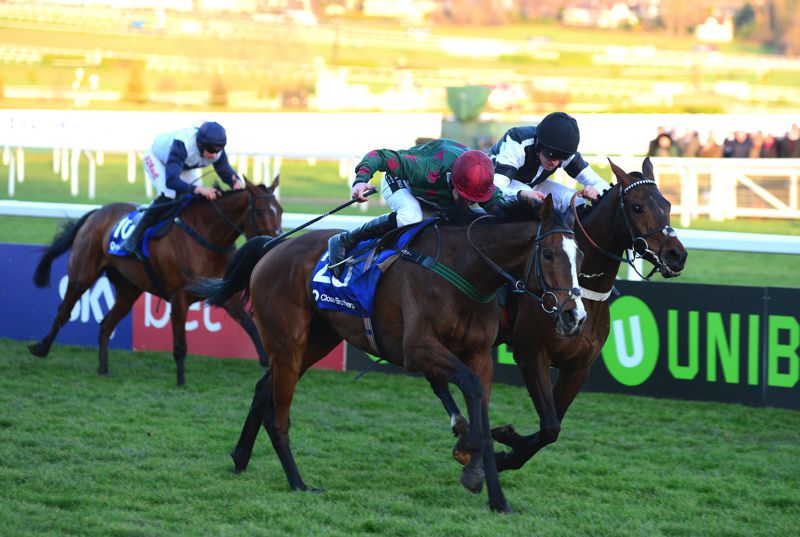 Mister Whitaker (near side) winning the Close Brothers Novices' Handicap Chase at Cheltenham in 2018