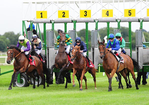 Sizzling (centre) breaks from stalls in the Group 3 Irish Stallion Farms EBF Give Thanks Stakes