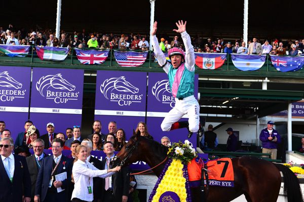 Frankie Dettori leaps from Expert Eye after their Breeders Cup victory