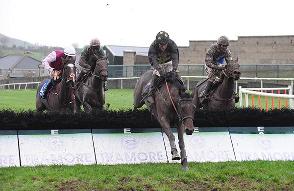 Stucker Hill (centre) drives for home under Danny Mullins