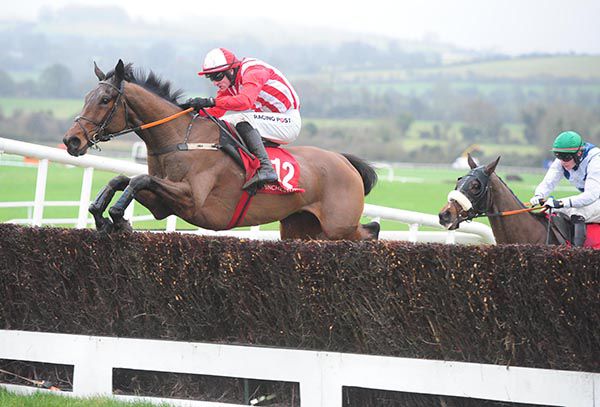 Young Paddymc and Danny Mullins jumps the last