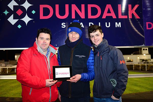 Edification's winning trainer Mark Fahey (centre) with owners Derek Murray and Cian Maher 