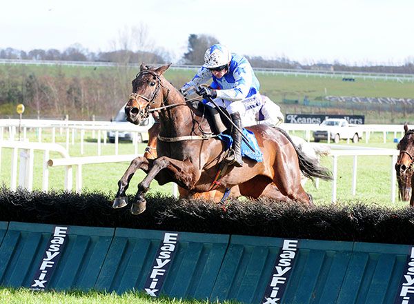 Robin De Carlow and Ruby Walsh jump the last 