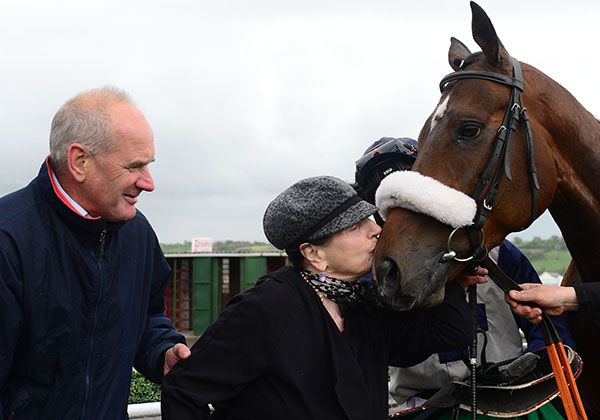 Newcross gets a kiss from Patricia Regan of Newtown Anner Stud as Tony Martin looks on