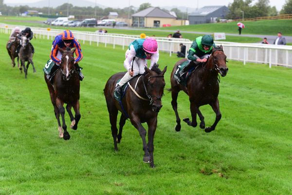 SISKIN (pink cap) winning the Group 1 Keeneland Phoenix Stakes at the Curragh.