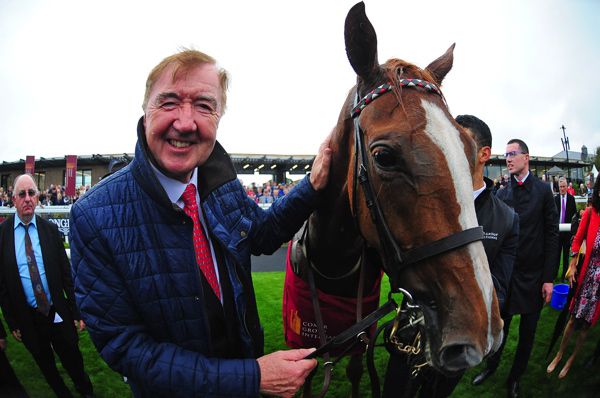 A delighted Dermot Weld pictured with his Comer Group International Irish St Leger winner Search For A Song