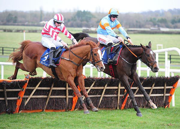 Battle Of Wills and Davy Russell (right) jump the last with Van Meegeren 