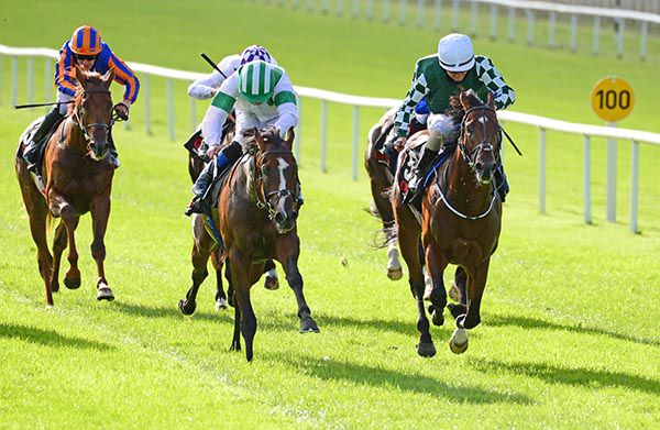 Laws Of Indices (green and white cap) winning the Railway Stakes at the Curragh