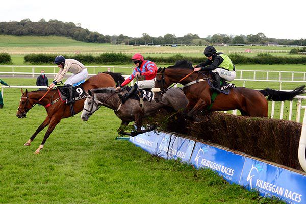 Jack Hackett and Cathal Landers (right) jump the last in contention before going on to beat The Echo Boy (far side)