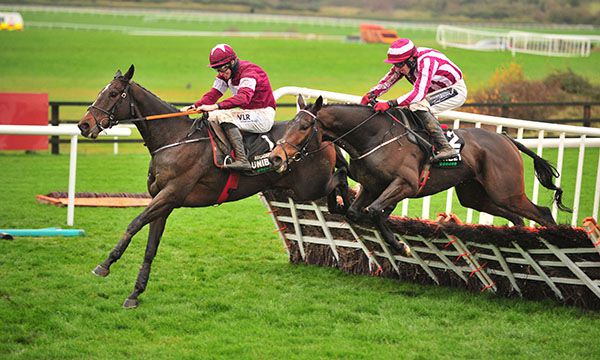 Eventual fourth Coeur Sublime (right) jumps the last just behind the winner Abacadabras in the Unibet Morgana Hurdle