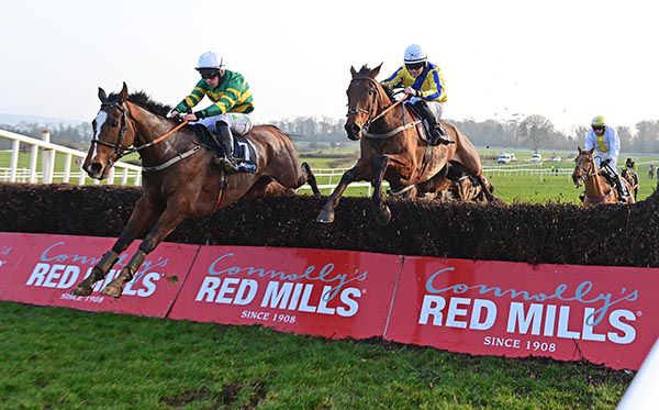 Weihnachts and Simon Torrens (left) lead over the last from The Chapel Field