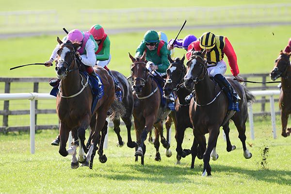 Acanella and Colin Keane (pink cap) win from Champers Elysees
