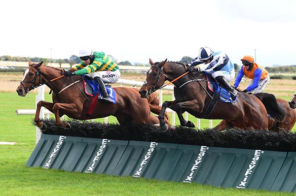 Glan and Mark Walsh (far side) jump the last ahead of Jeremys Jewel
