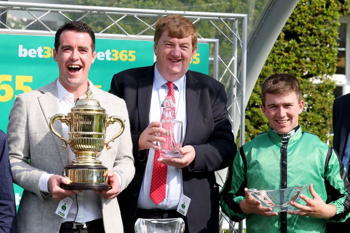 Shark Hanlon and Jordan Gainford, with owner T J McDonald holding the bet365 Gold Cup