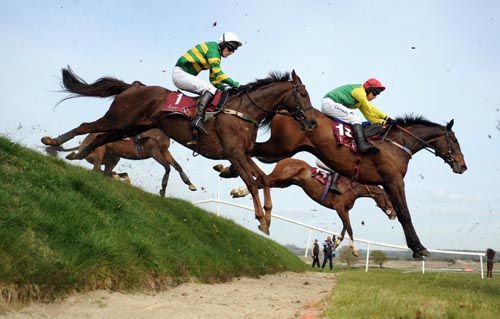 L'Ami and John Thomas McNamara (near side ) land over Rubys Double with Sizing Australia