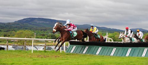 Fearnwood Girl jumps a hurdle in front on her way to victory at Sligo.