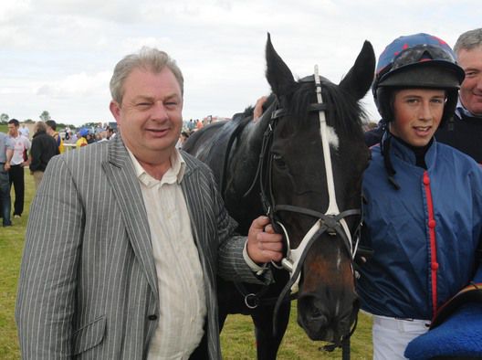 Owner David Adams and jockey Bryan   Cooper after Isabellareine won