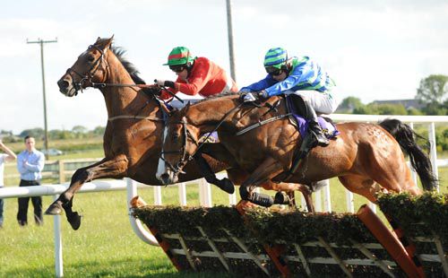 Cyclinder Rattler (near) and Paul Townend jump the last to win from Trptronic and Andrew McNamara
