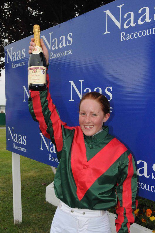 Maria Quinlan receives a bottle of champagne   for winning aboard Talkin Kate