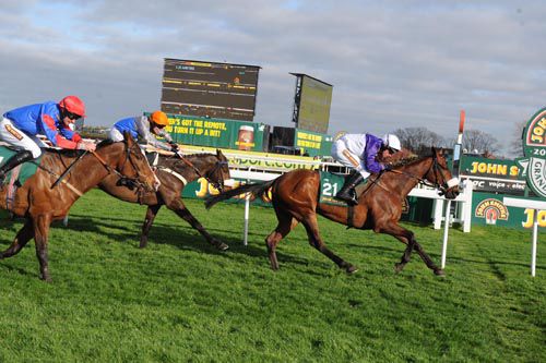 Russian War (Paul Carberry) winning the Listed handicap hurdle at Aintree