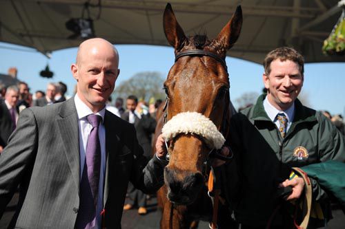 Trainer Colm Murphy and groom John Waifer with Quito De La Roque after their win 