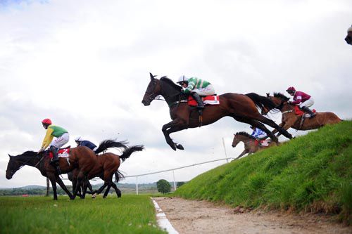 Nina Carberry and Freneys Well (centre) clear Rubys Double obstacle