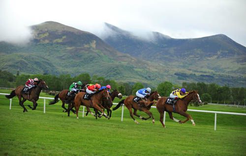 Trans City (leading) strides to victory as the clouds come down on the mountains 