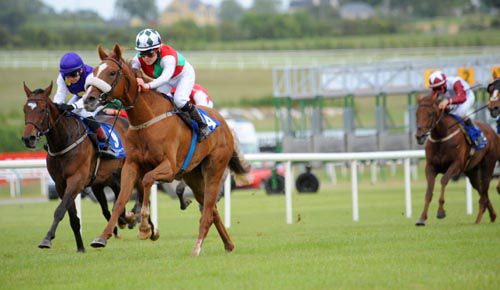 Goldplated (noseband) has her ears pricked as she passes Hangar Five