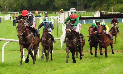 Chapter Eleven, red cap, keeps Riotman, green sleeves, at bay in Kilbeggan