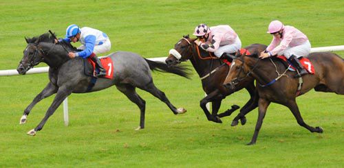 The grey Greek Canyon stays on well for Keagan Latham to defy top-weight in the nursery