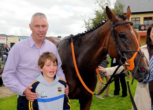 Restricted trainer Martin Hassett with son Jack, after Nurse Ryan had won