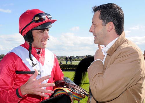 Davy Russell (left) chats to James Nash after partnering Your Busy to victory