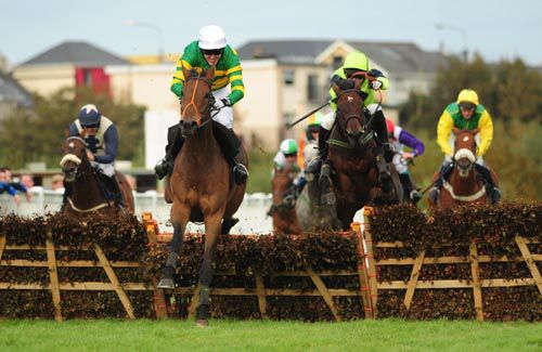 Code Of The West (middle) jumps the last on his way to victory