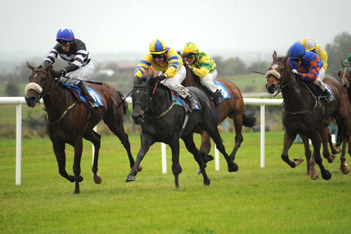 Winning Impact (centre, Declan McDonogh) beats Balladiene (right) and Brazilian Bride (left)