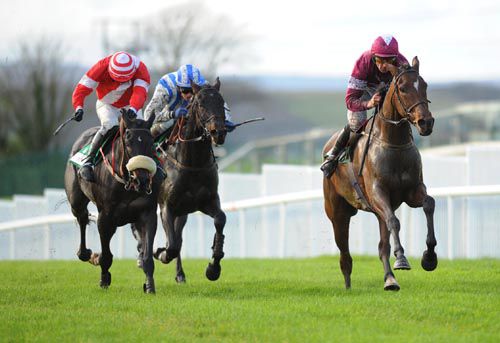Davy Russell & Best Served Cold (right) pass Just For Joe (left) and Laganbank on the run to the line.