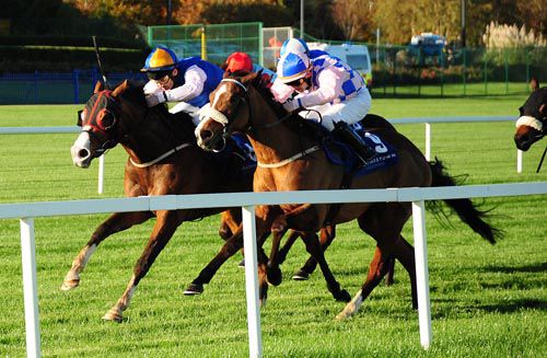 Enchanted Evening (blinkers) hits the front passing stablemate Catch The Eye (on the rails)