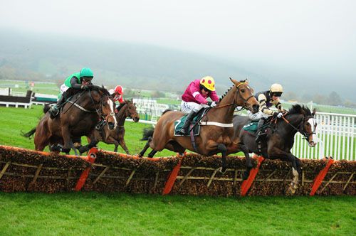 Steps To Freedom and Robert Power (left) jumping the last with Ericht and Prospect Wells