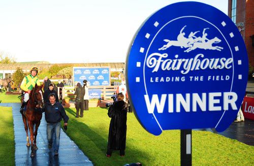 Too Scoops is led back into the winner's enclosure