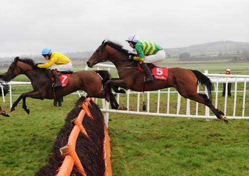 The Bishop Looney (5) jumps the final flight in third place